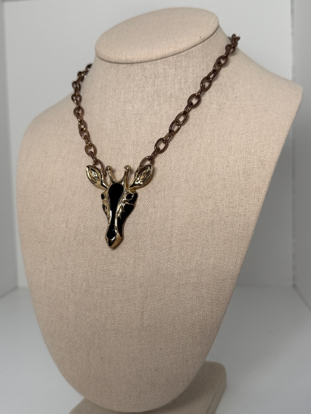 Gold Tone Giraffe Pendant Necklace with Black Enamel
